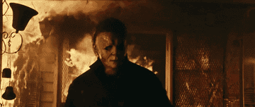 Michael Myers walking away from a burning building.