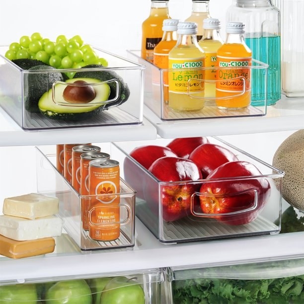 Clear plastic organizers used for food and drinks in the fridge
