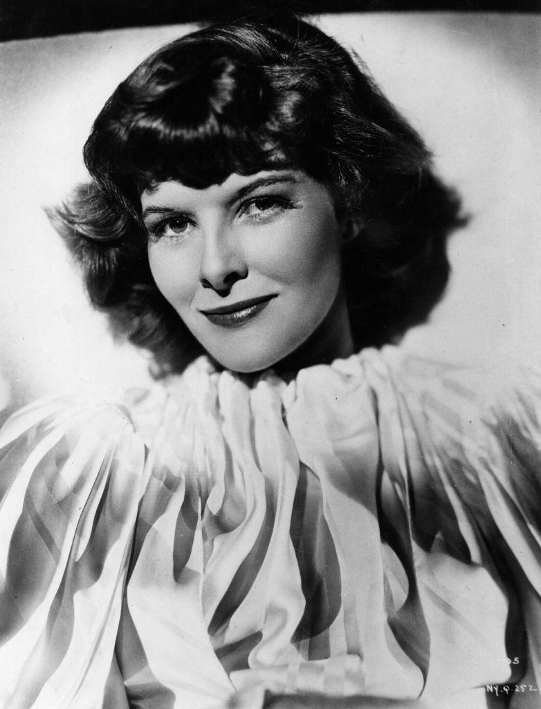 A young Katharine smiling in a black-and-white photo