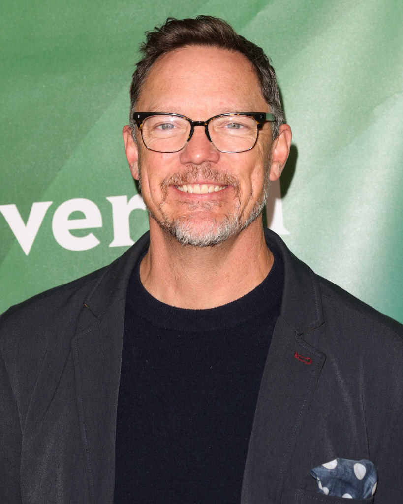 Headshot of Matthew in glasses and smiling