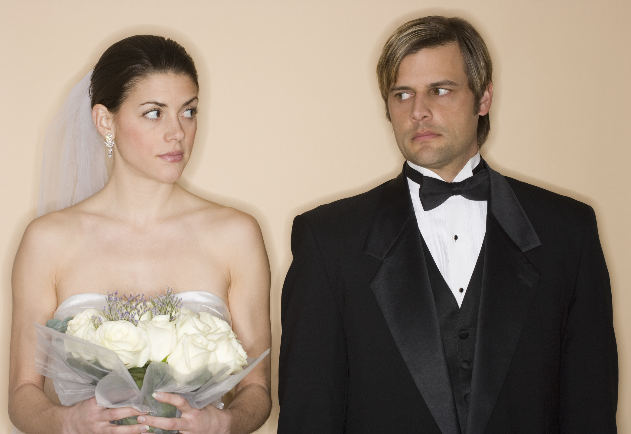 bride and groom standing next to each other with no excitement