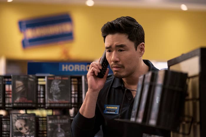 The character played by Randall Park on the phone
