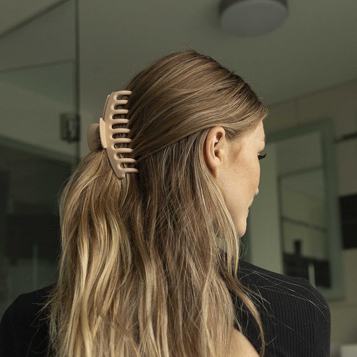 A person wearing a clip in their hair