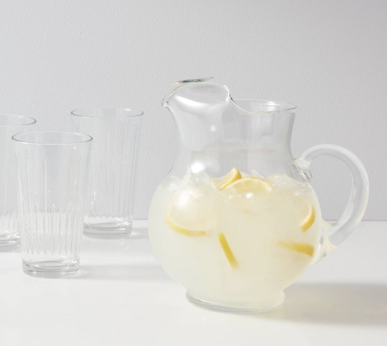 A glass pitcher filled with lemonade