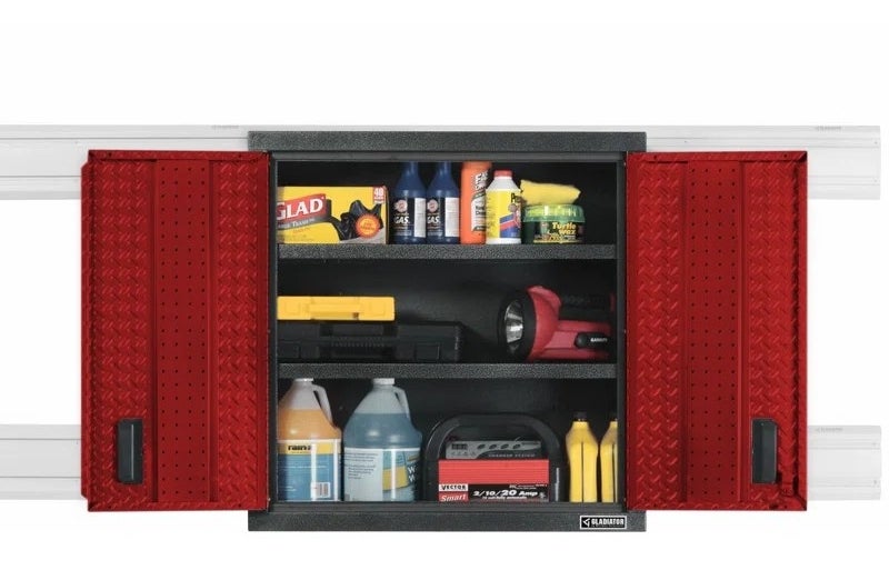 A wall-mounted tool box with two shelves, and red doors.