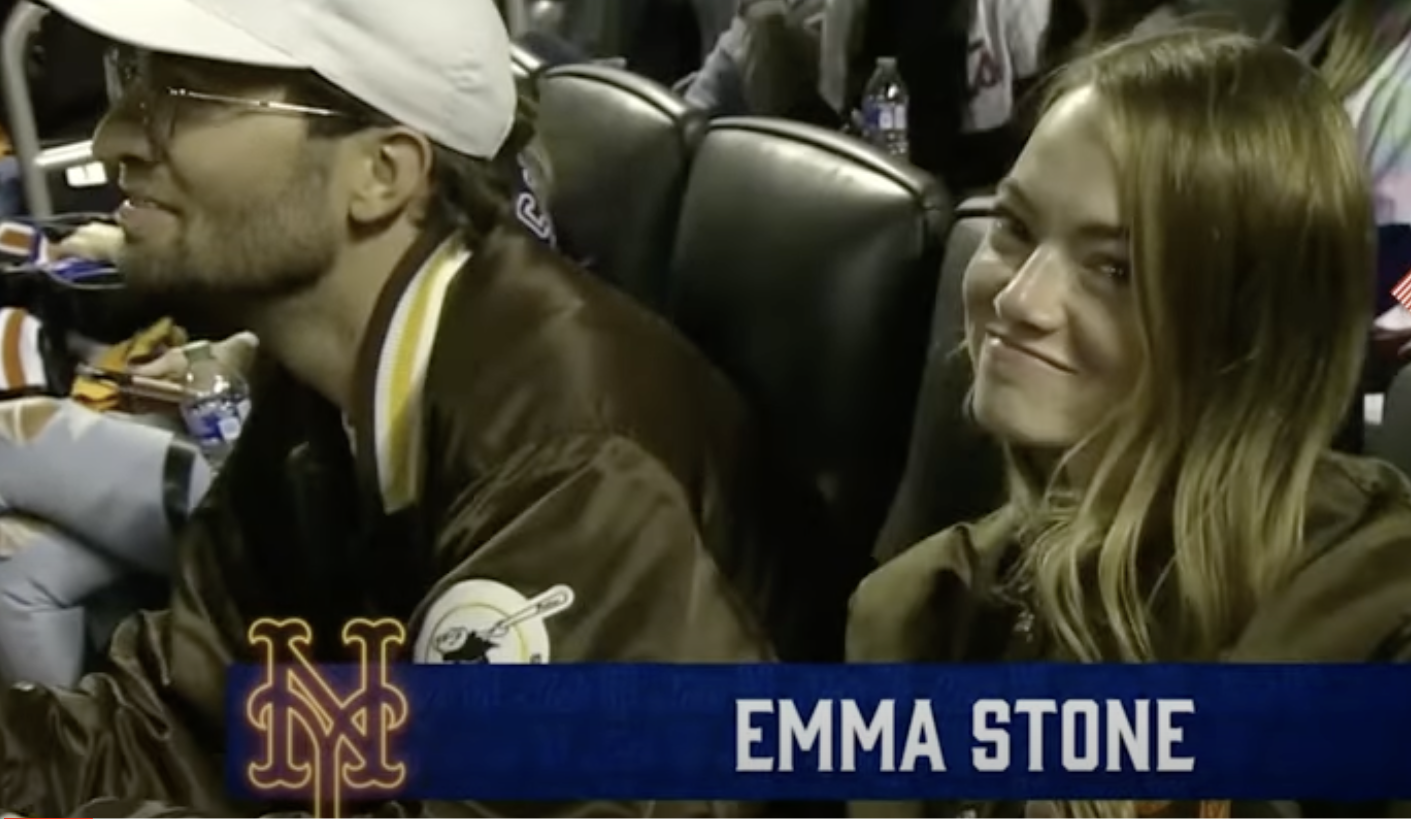 Dave McCary and Emma Stone at a baseball game