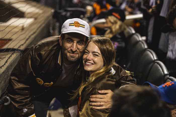 Dave McCary and Emma Stone at a baseball game
