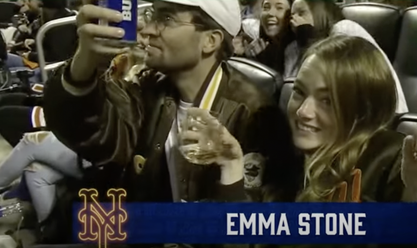 Dave McCary and Emma Stone holding up their drinks