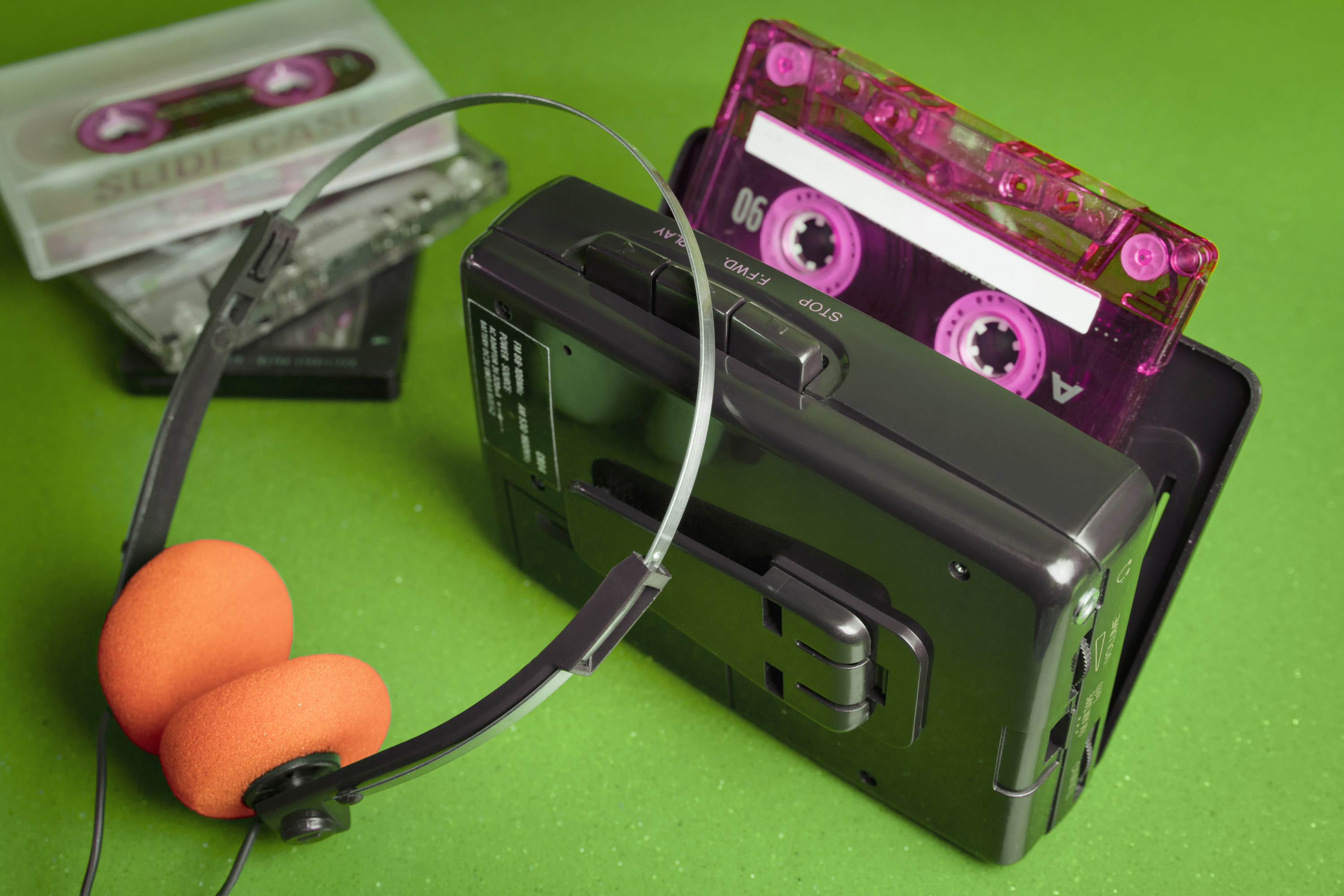 Cassette personal player music 80s with orange pads headphones