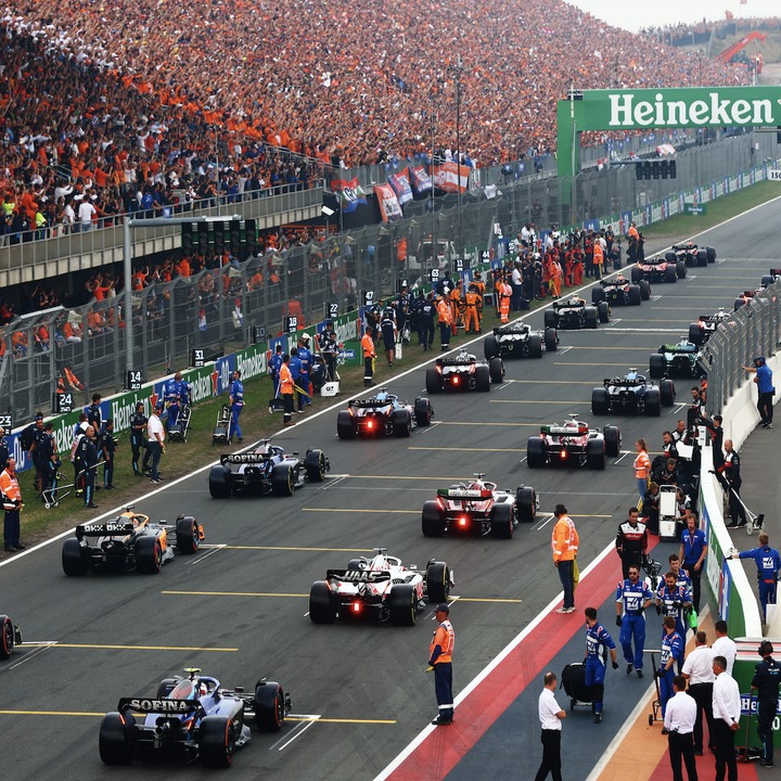 a high-angle view of the formula 1 cars lined up ready to start the race
