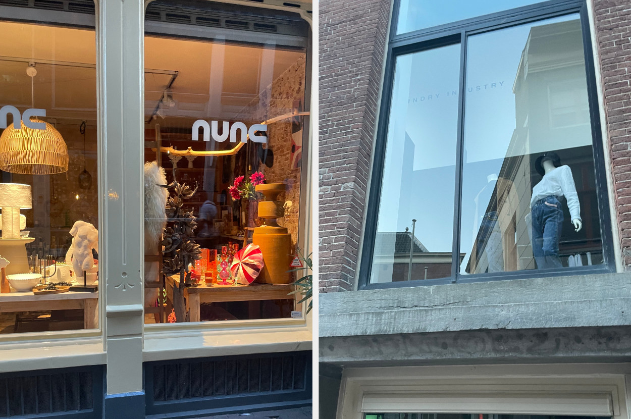 two of amsterdam&#x27;s boutique display windows showing home decor and fashion