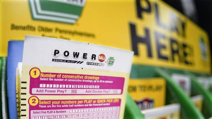 A  blank powerball card on a rack inside a shop