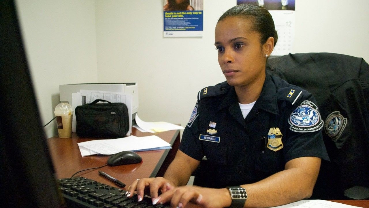 An officer types on her computer