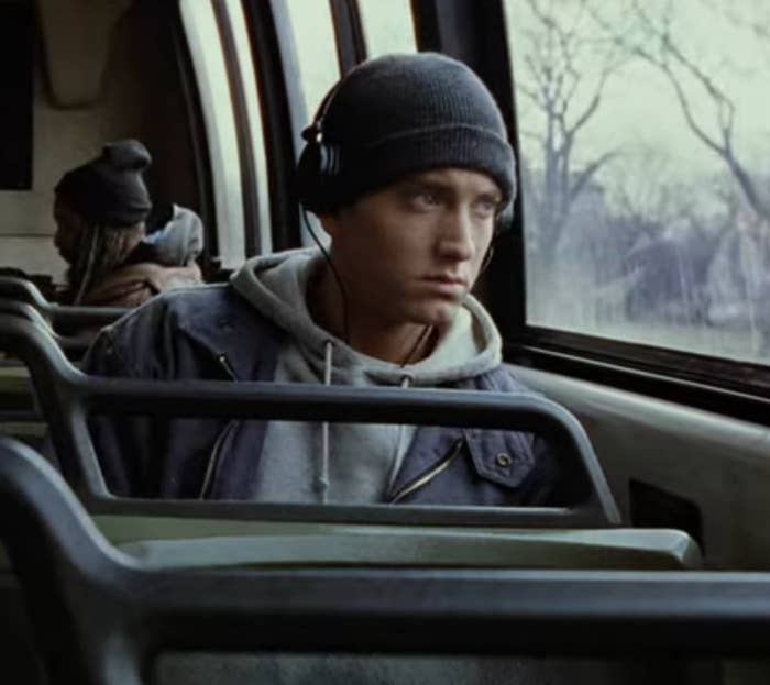 Eminem as Jimmy listens to music during a bus ride