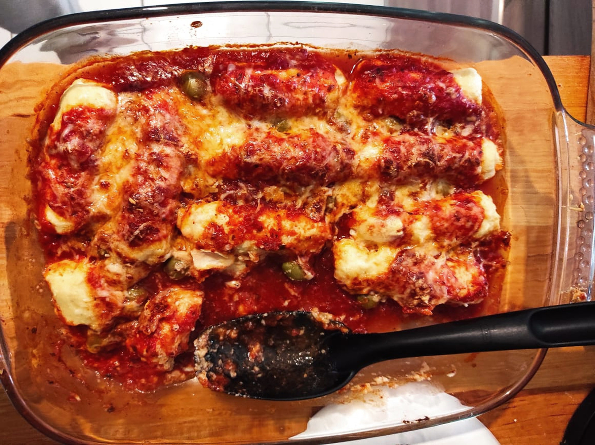 Pasta with tomato sauce in a Pyrex baking dish.