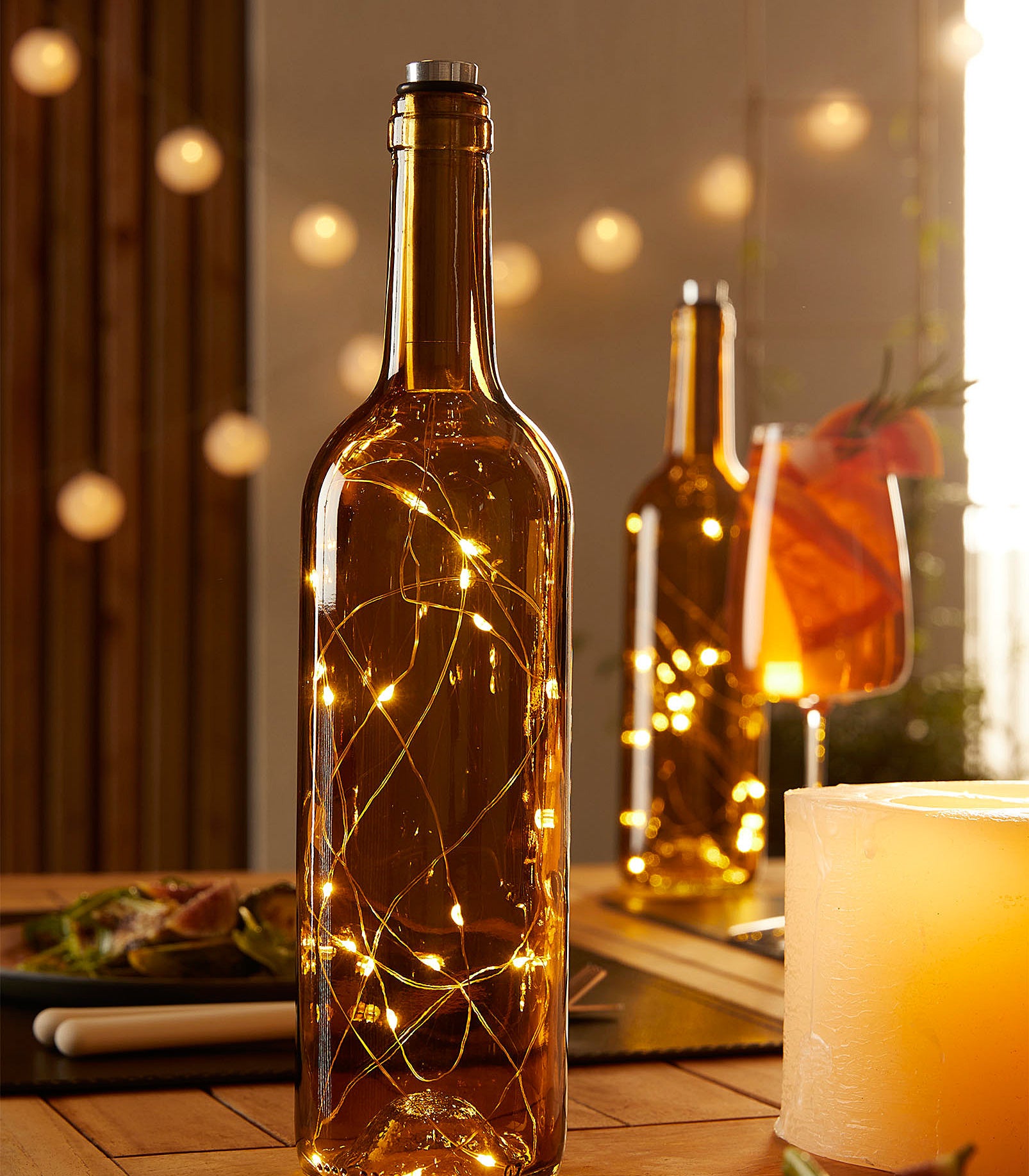 a wine bottle with fairy lights inside