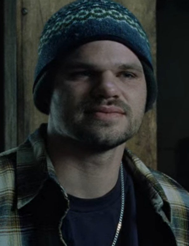 Evan Jones as Cheddar Bob wears a beanie and flannel shirt in &quot;8 Mile&quot;