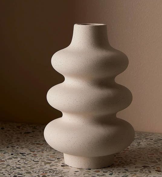 a ceramic vase on a counter