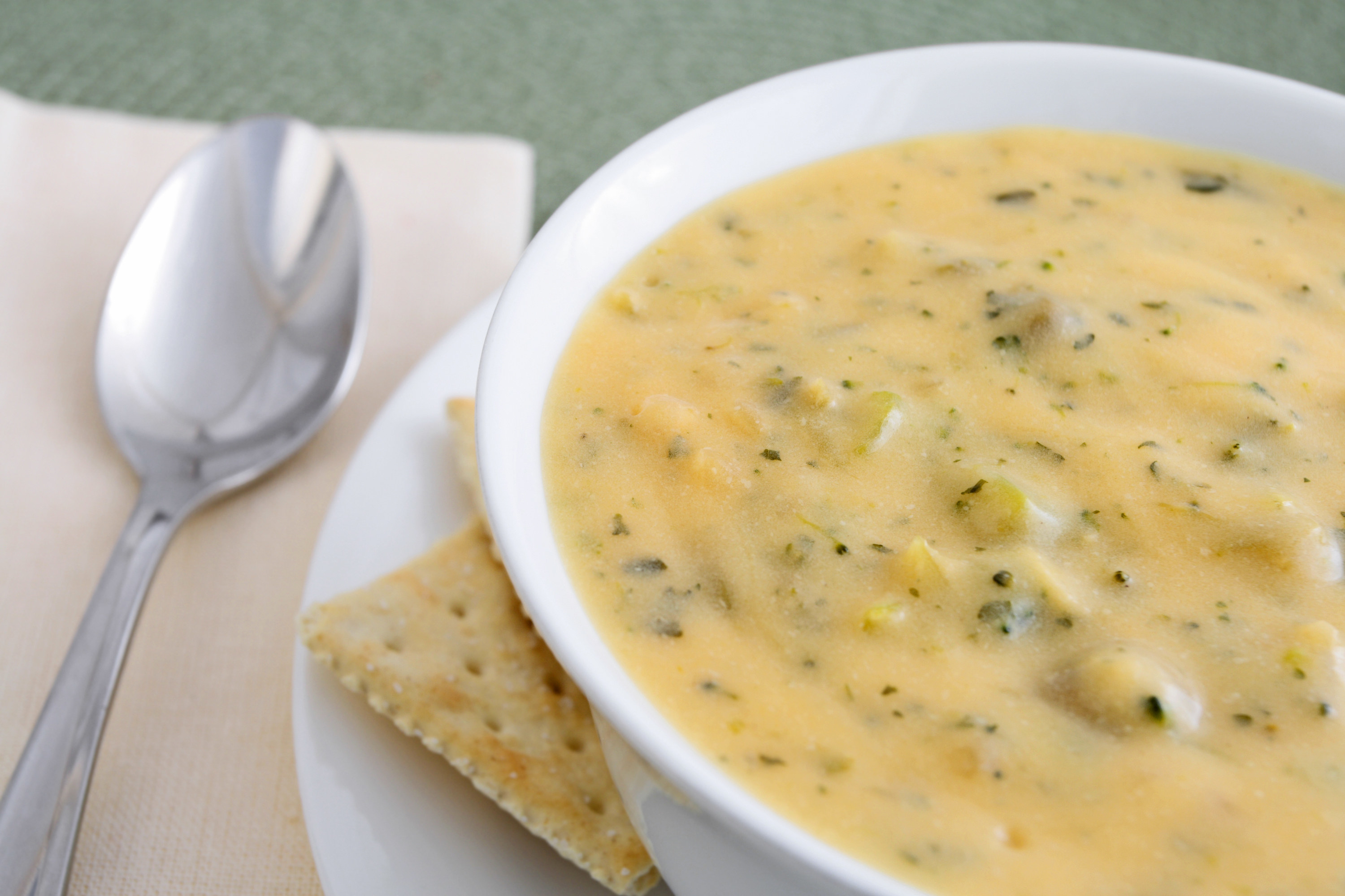A bowl of cheesy broccoli soup