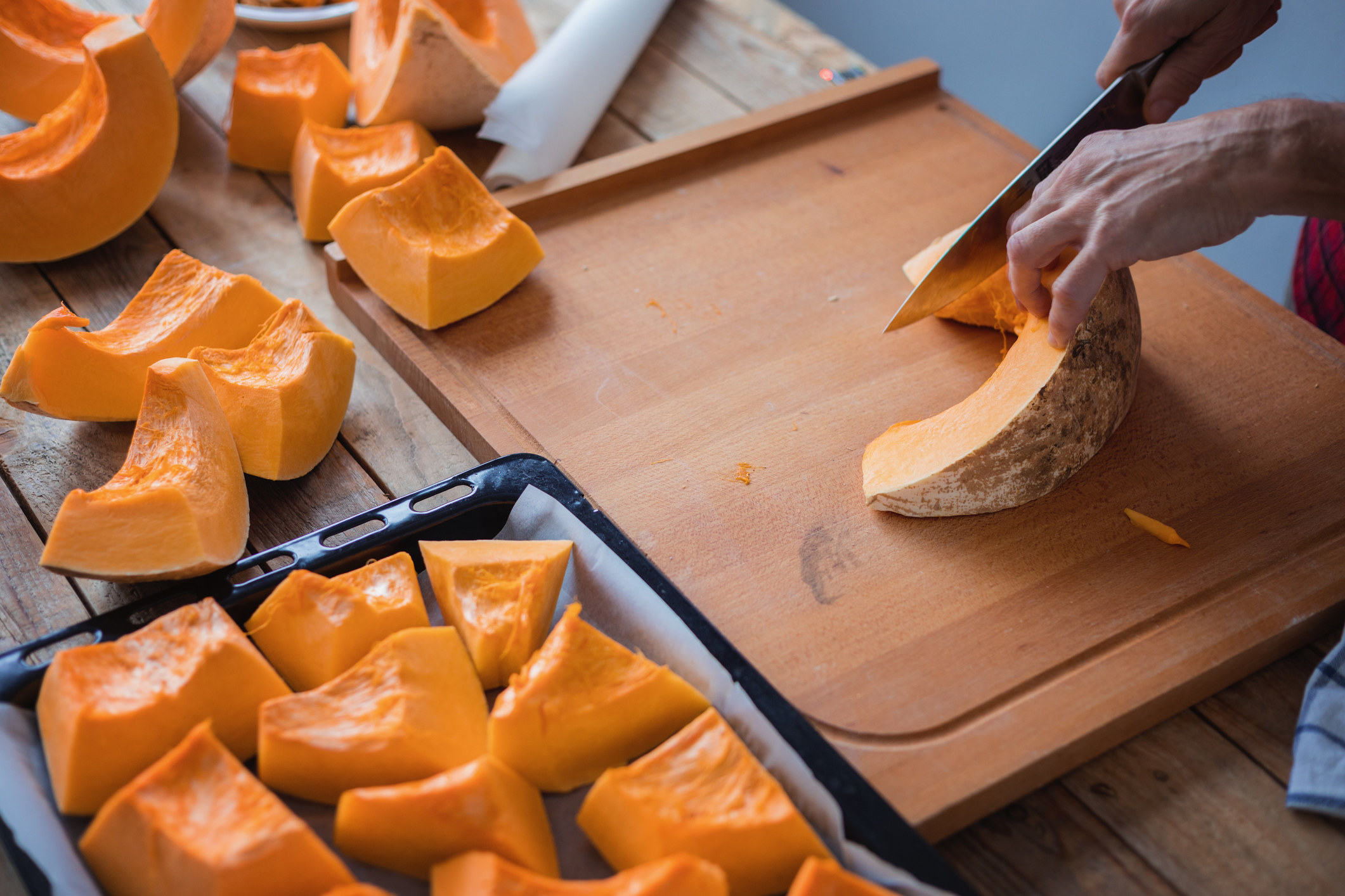 Cutting pumpkin into pieces for cooking