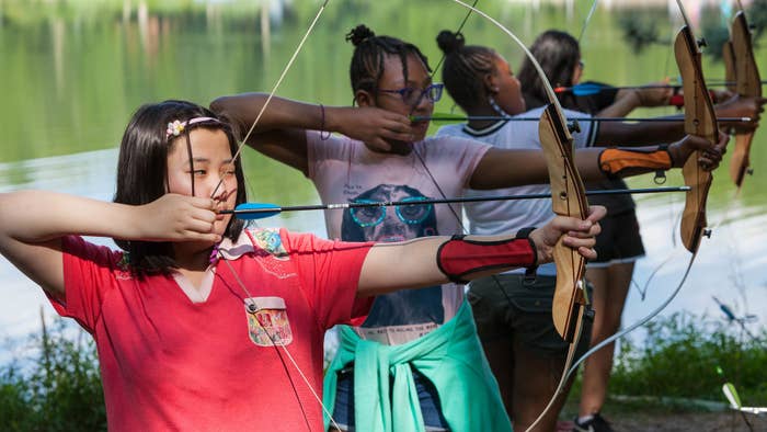 Girls practicing archery