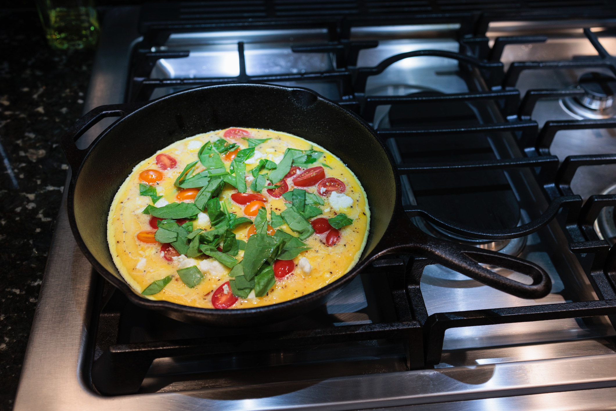 an omelet in a cast iron skillet