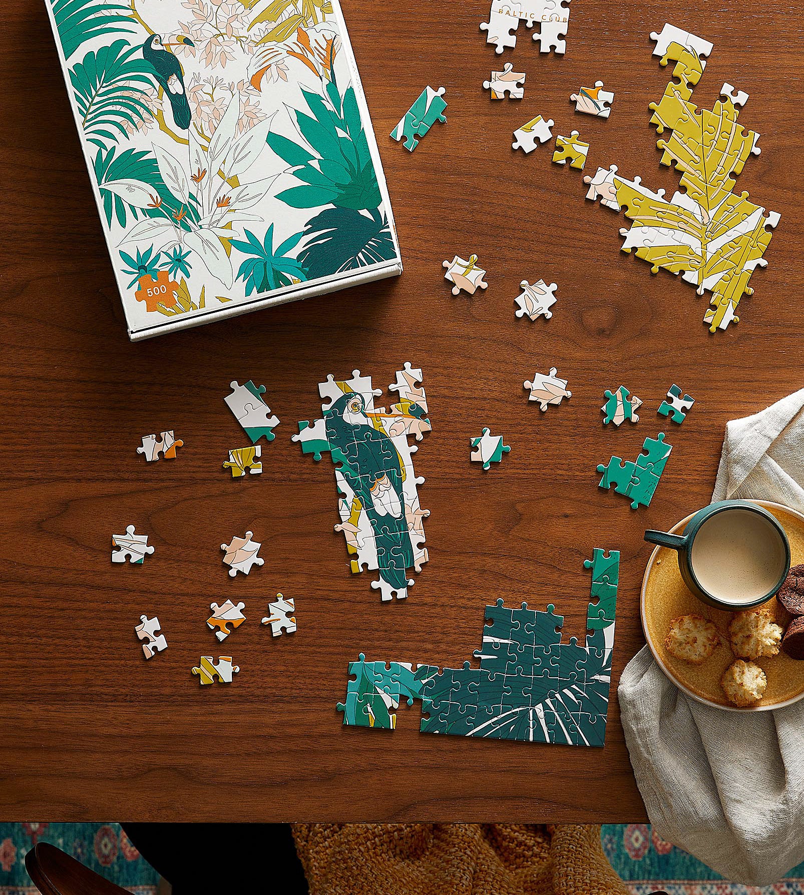 a floral puzzle on a wood surface