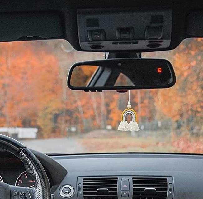 the charm hanging from a rearview mirror