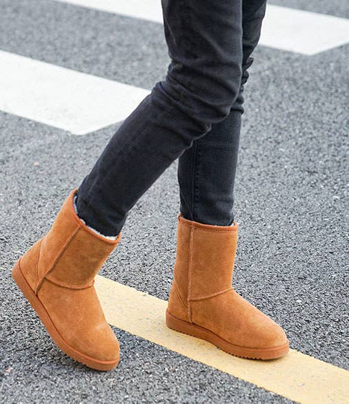 model wearing the chestnut boots with black pants