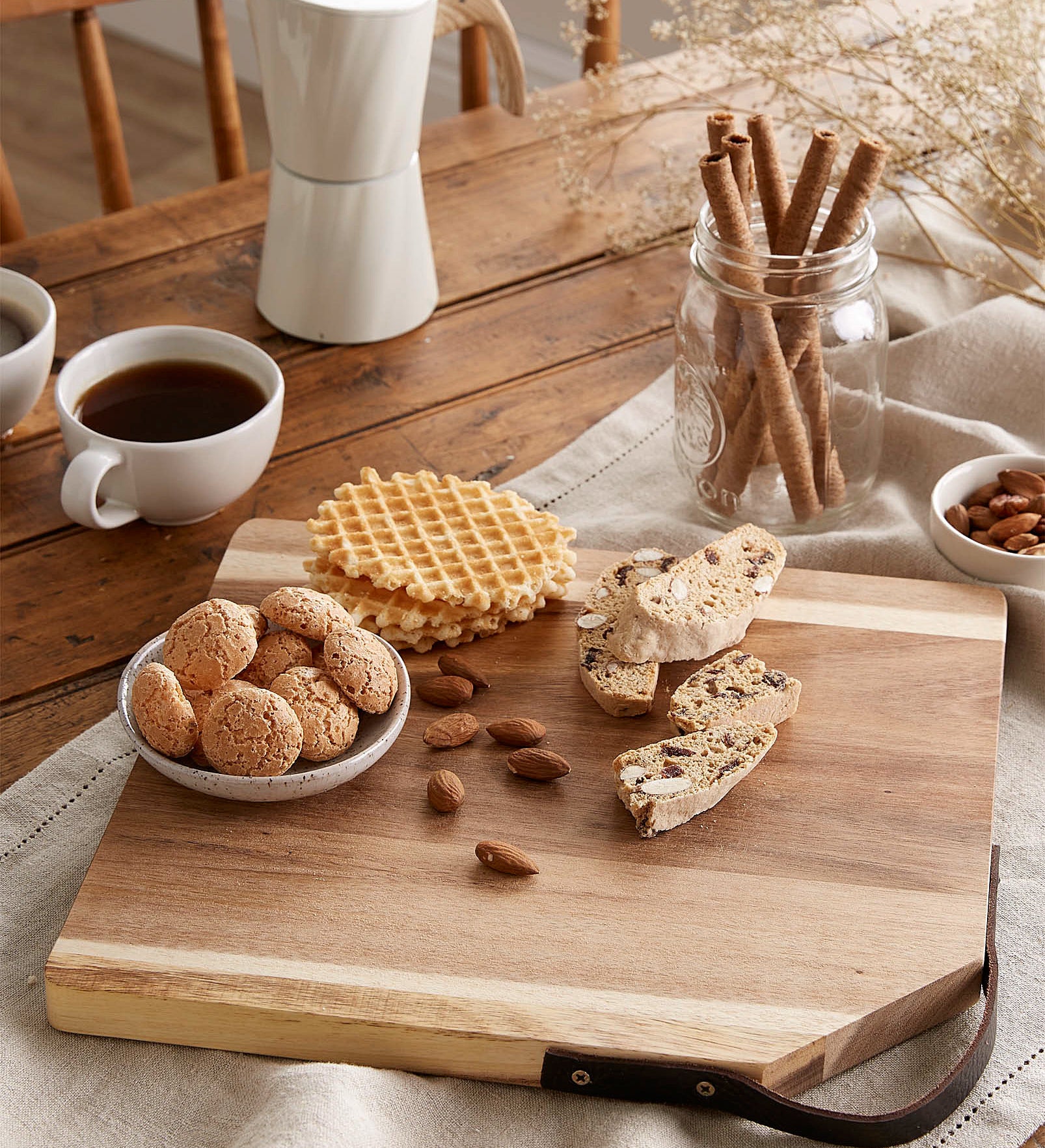 a serving board with sweets and treats on it