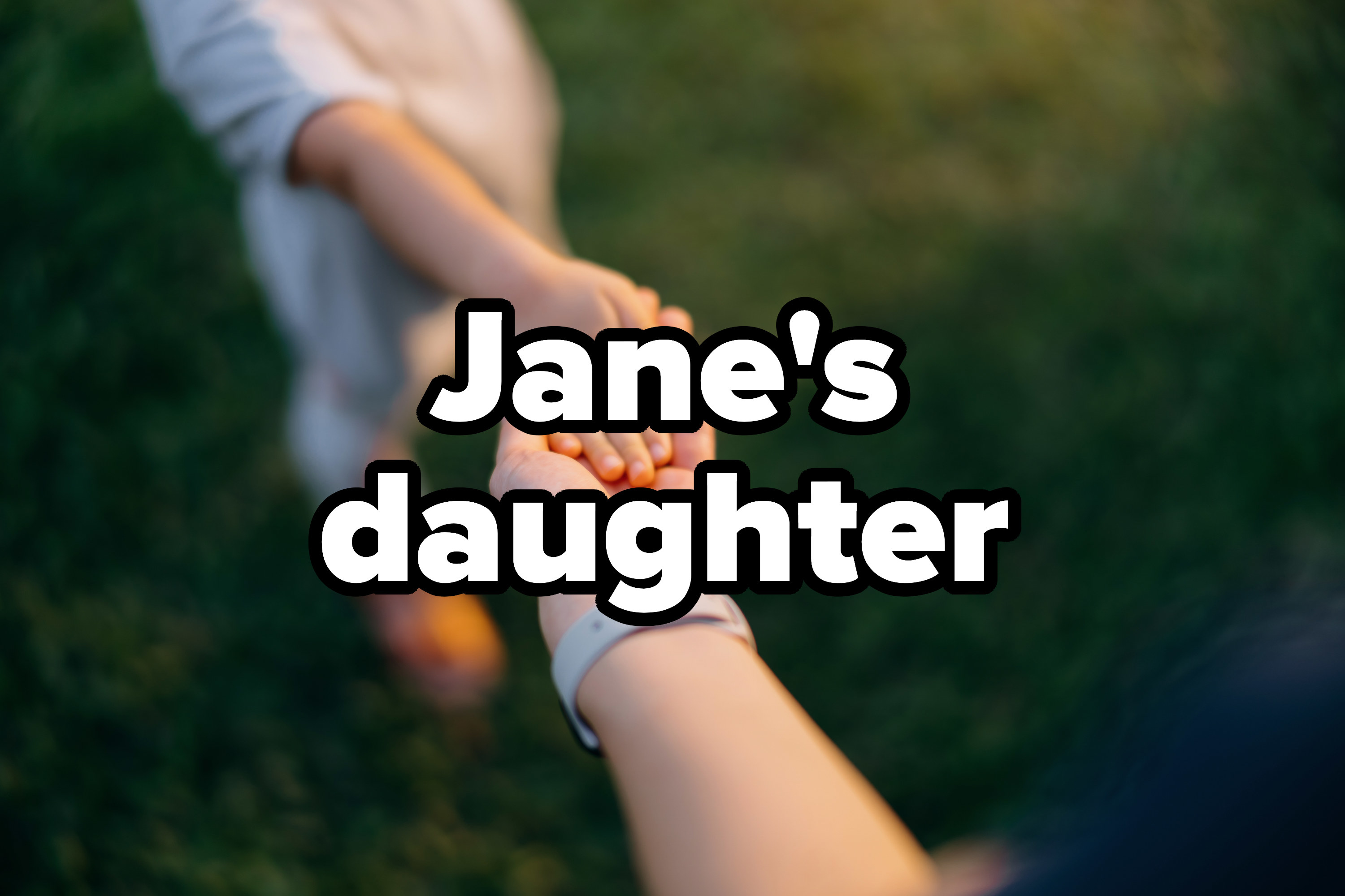 Text reads &quot;Jane&#x27;s daughter&quot; over close up of mother holding hand of little daughter on lawn.