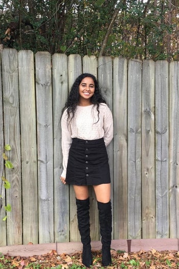 another reviewer wearing the black boots with a skirt