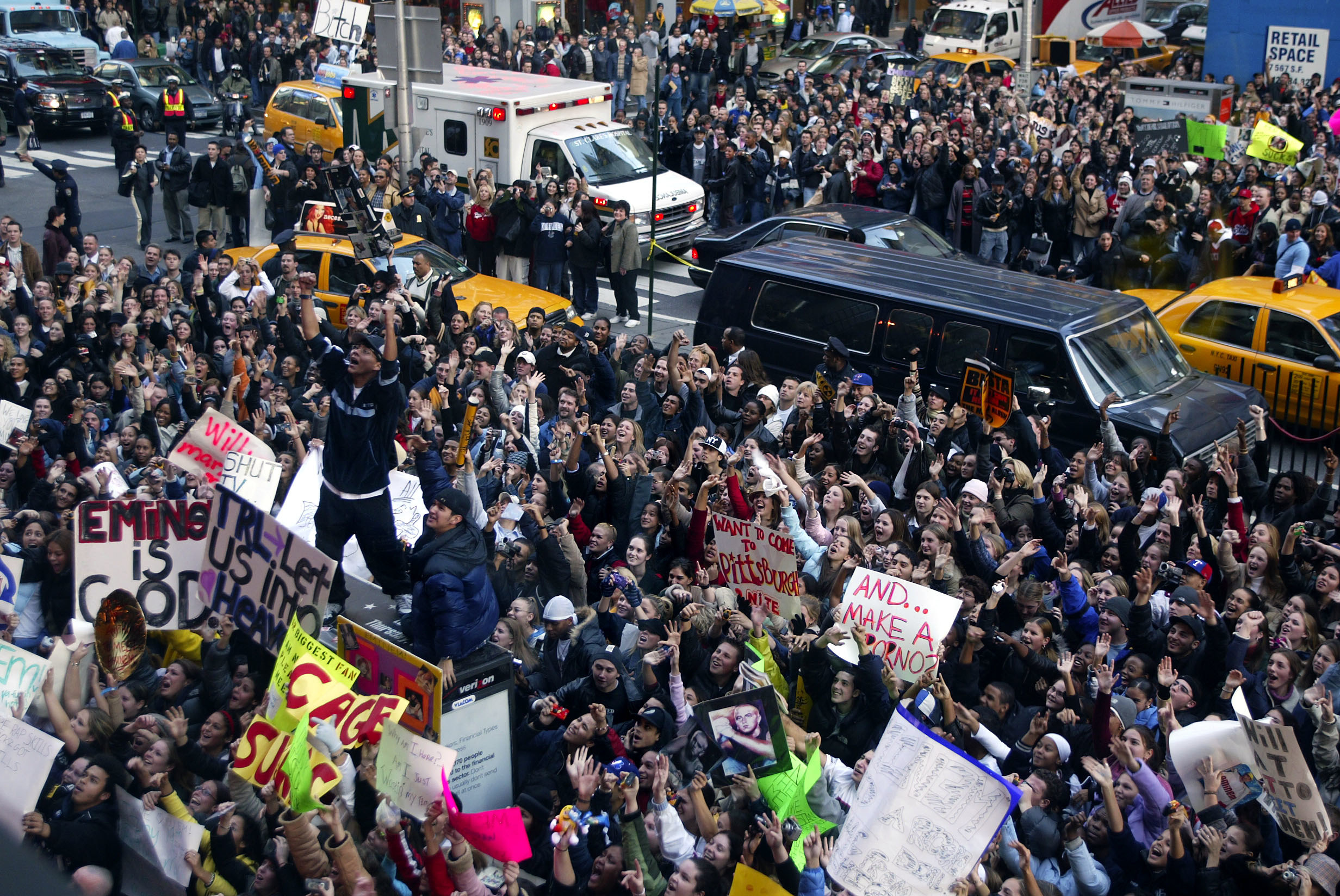 Crowds clog the streets bringing traffic to a halt in Times Square with hopes of getting a glimpse of Eminem during his appearence on TRL at the MTV studios in New York City