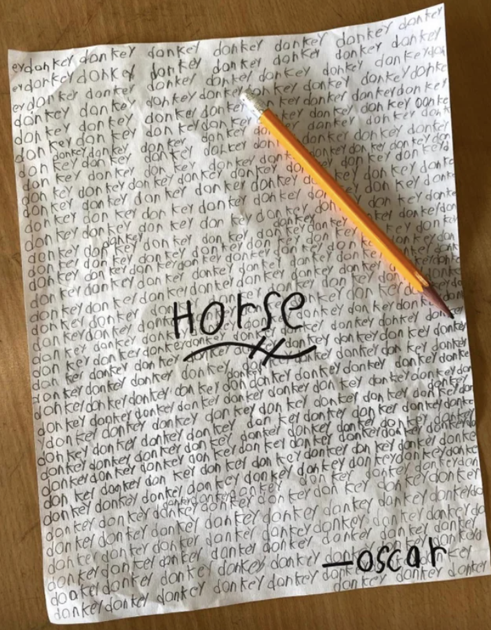 Horse written on a sheet of paper that says &quot;donkey&quot; repeatedly