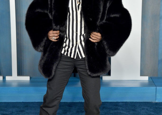 Stanfield wearing a fur coat at a red carpet event