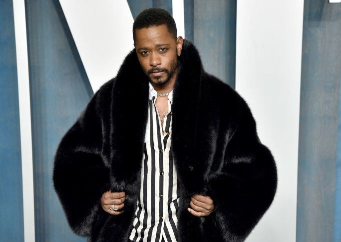 Stanfield wearing a fur coat at a red carpet event