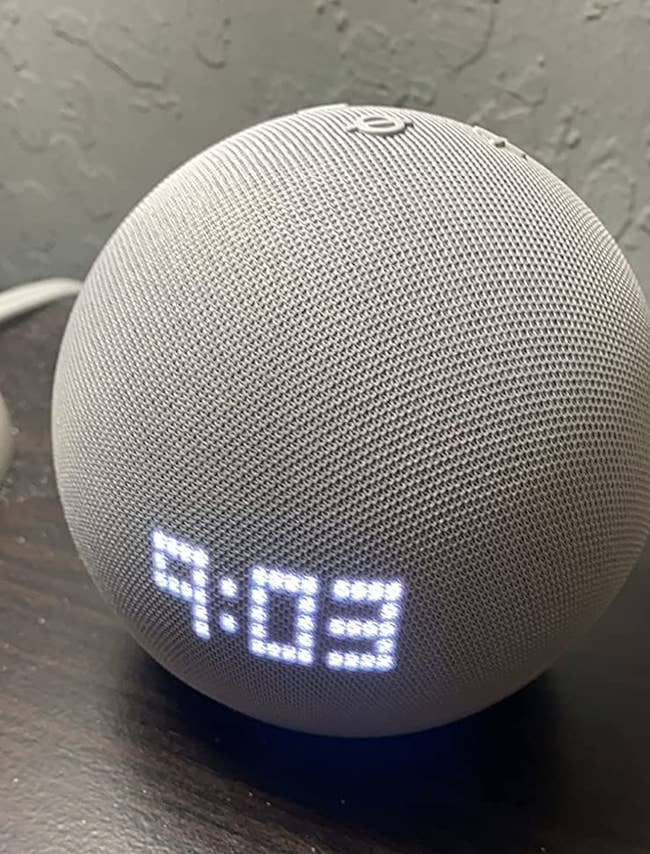 the Echo Dot illuminated with the LED clock display