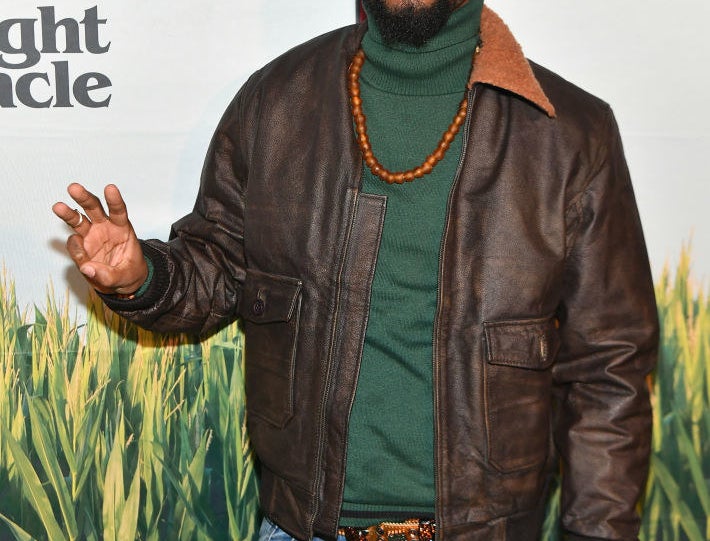 LaKeith Stanfield waving at photographers at an event