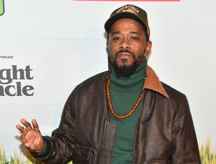 LaKeith Stanfield waving at photographers at an event
