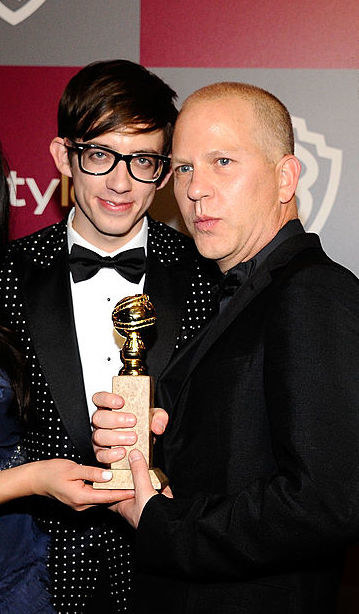 Kevin and Ryan holding their Golden Globe award