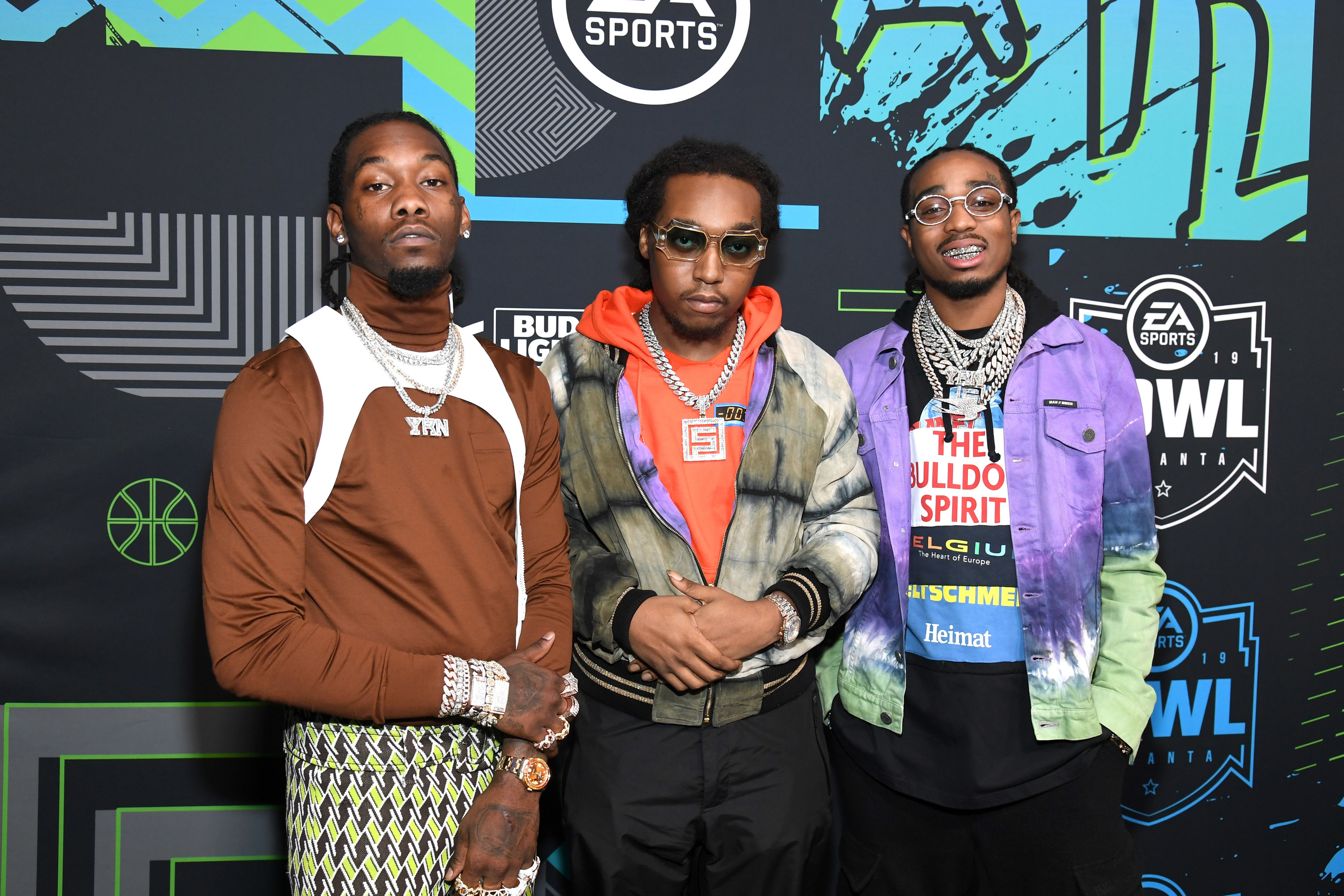 Migos posing on red carpet