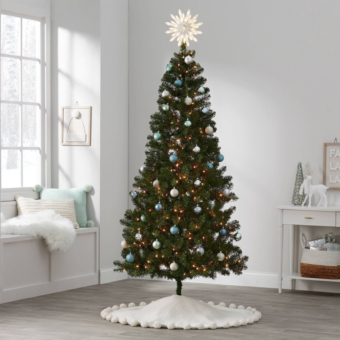 The tree with ornaments in a living room