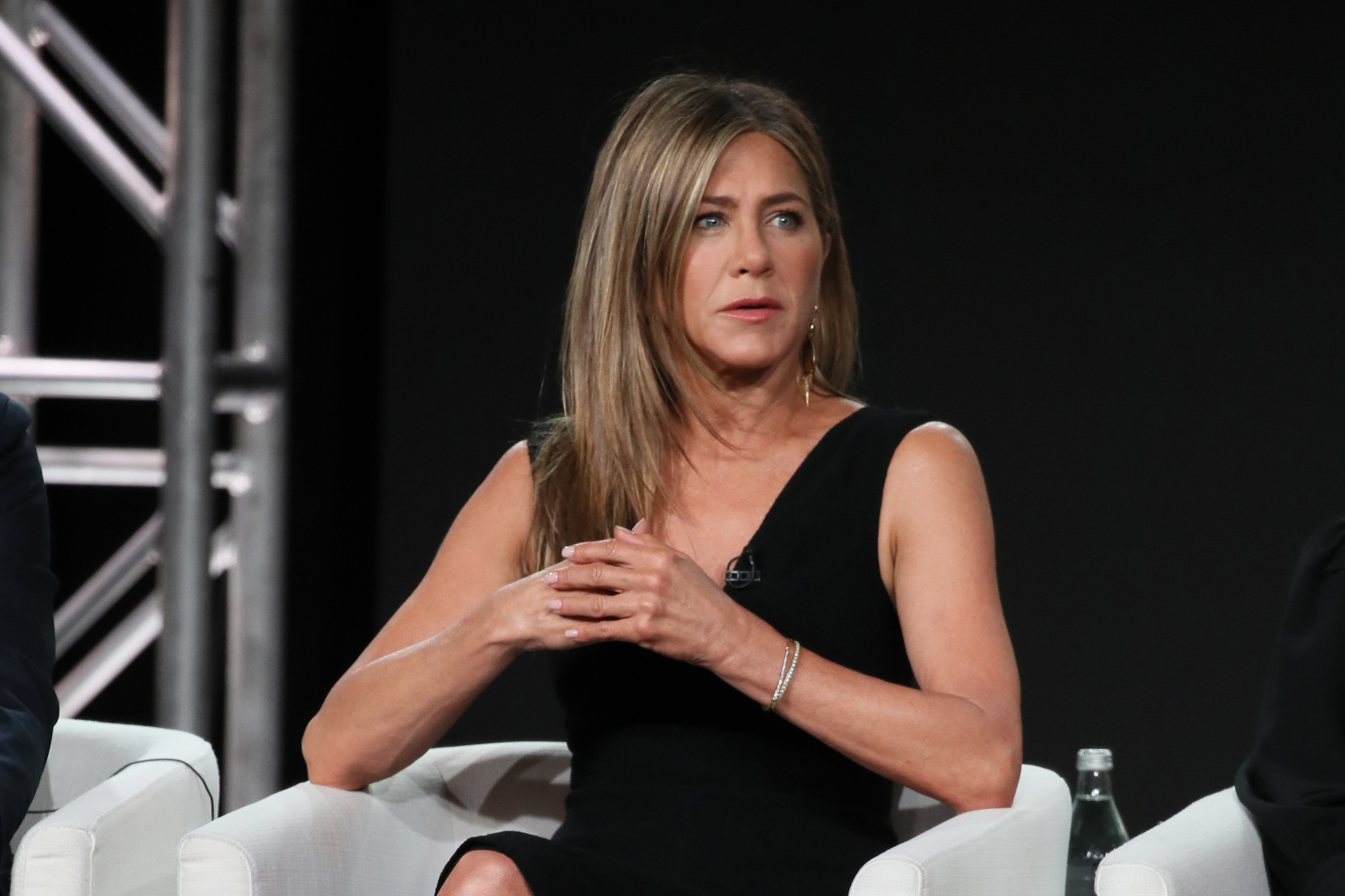 Jennifer Aniston bares it all in TINY Chanel bra while discussing  infertility struggle