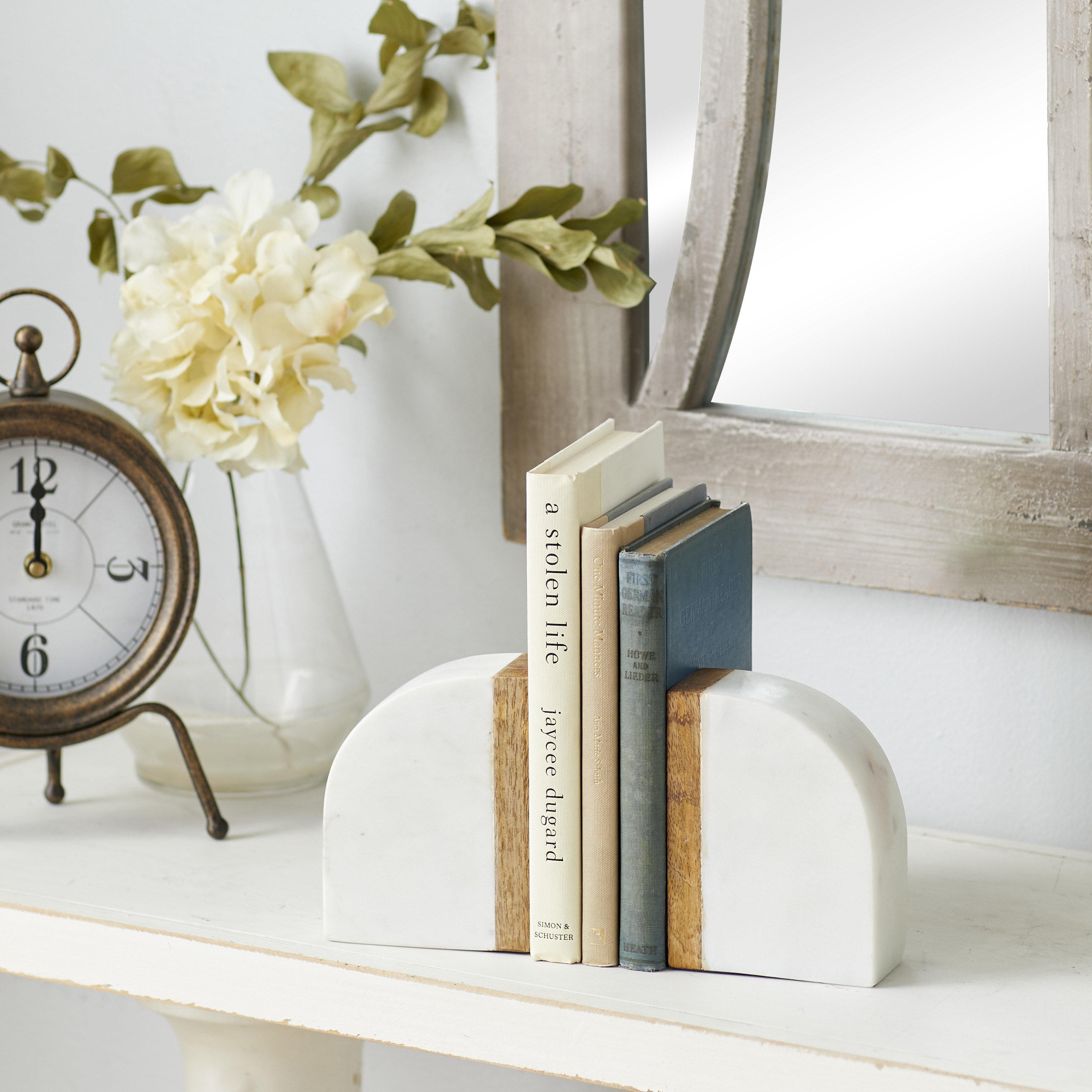 the white and brown marble bookends holding books together