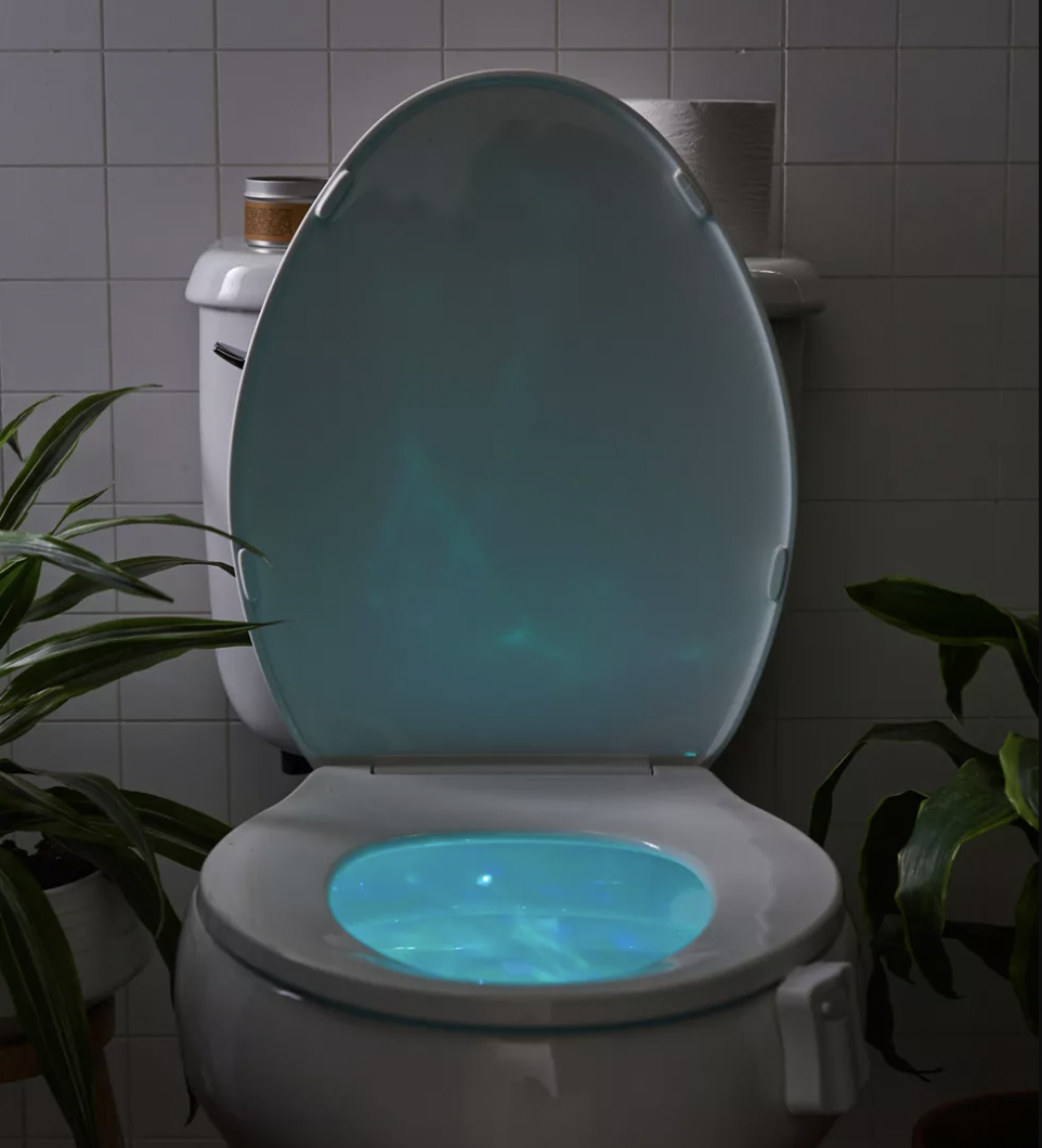the toilet bowl light lit up in a dark toilet bowl