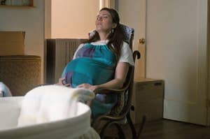 Mandy Moore sitting in a rocking chair in an unfinished nursery with a pregnant belly as Rebecca on This Is Us