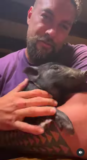 Jason holding his pig