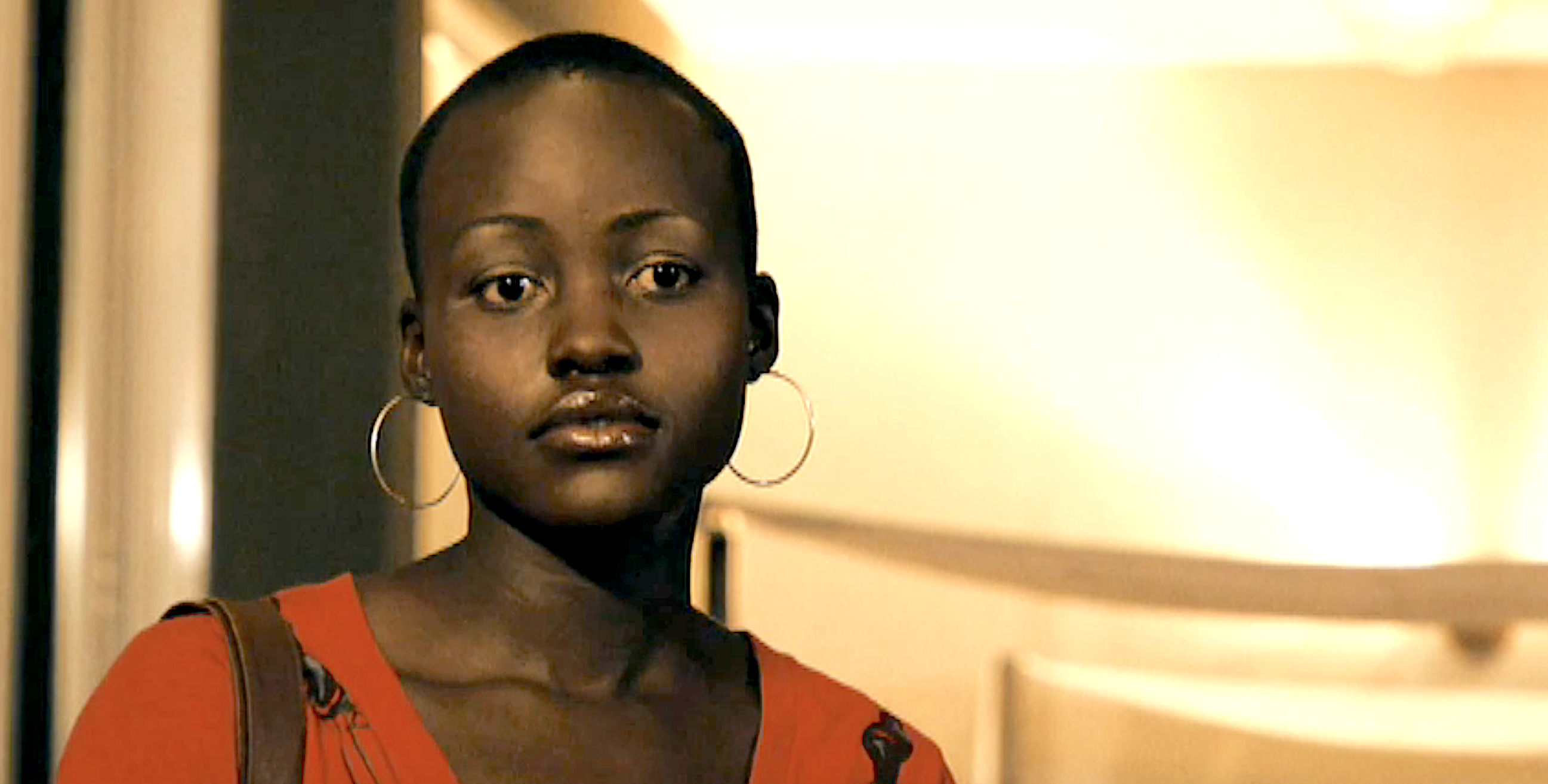 Close-up of Lupita with hoop earrings