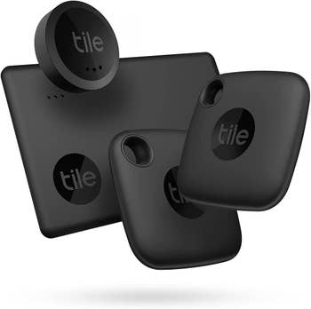 four tile trackers in black