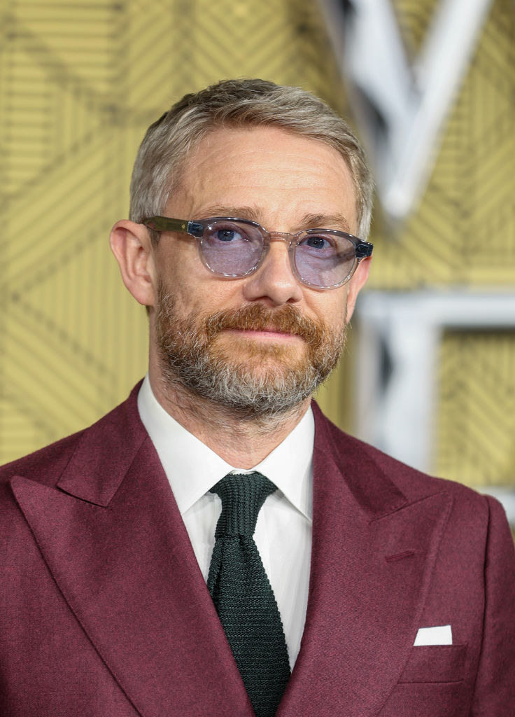 Martin in a suit and tie and sunglasses